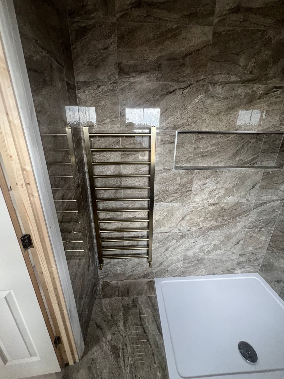 Heated towel rail, brushed gold finish