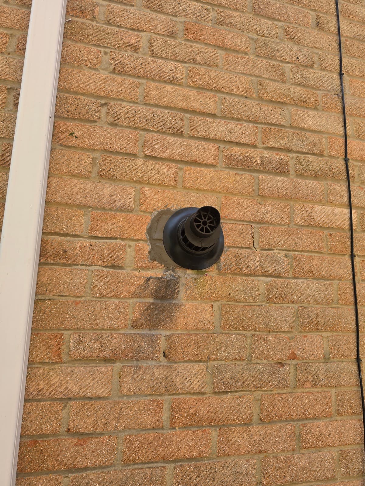 Flue terminal fitted through outer wall